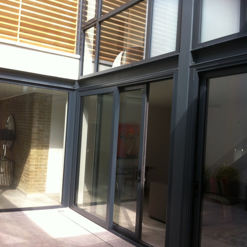 Anthracite aluminium sliding patio doors fitted in Winchmore Hill