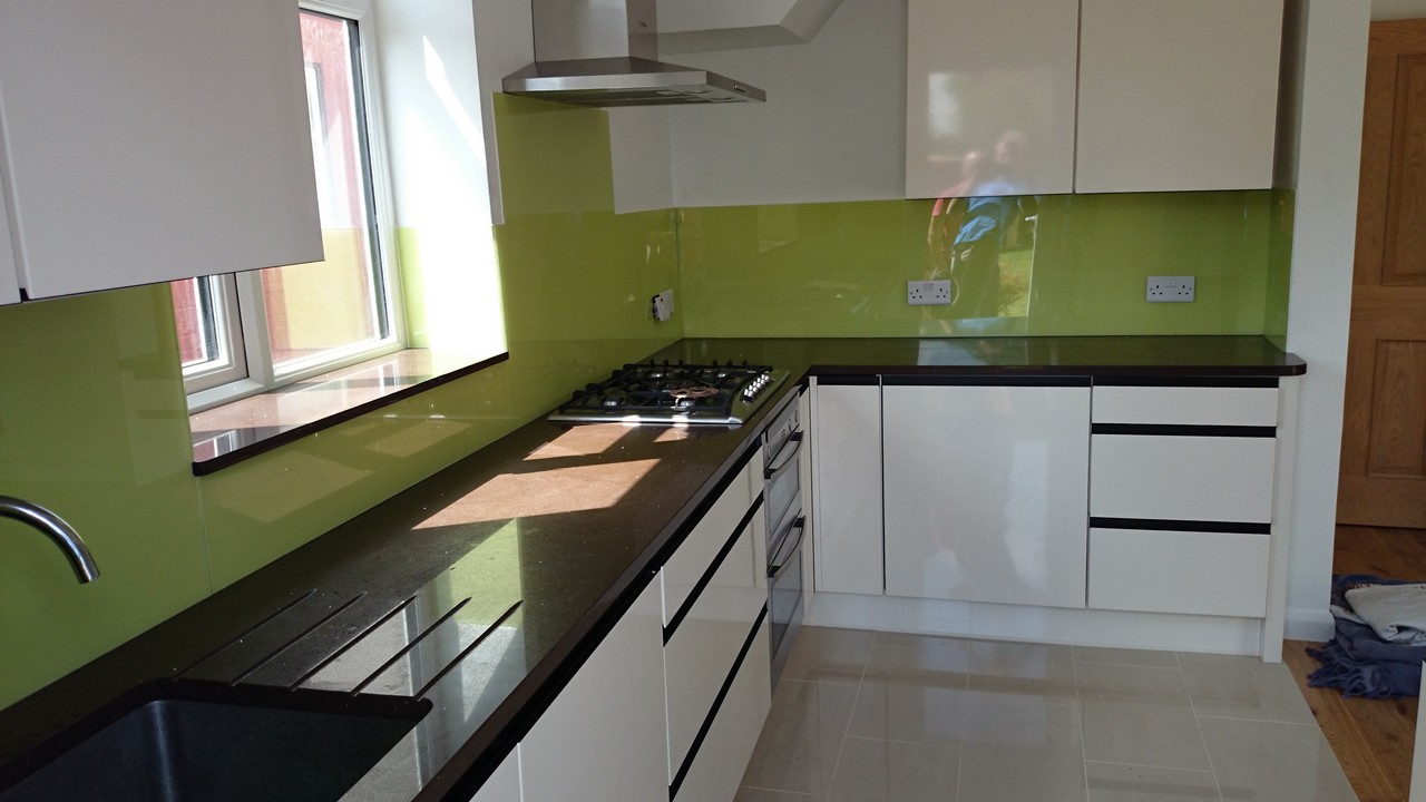 Lime green glass kitchen splashback installed by Winchmore Hill glaziers