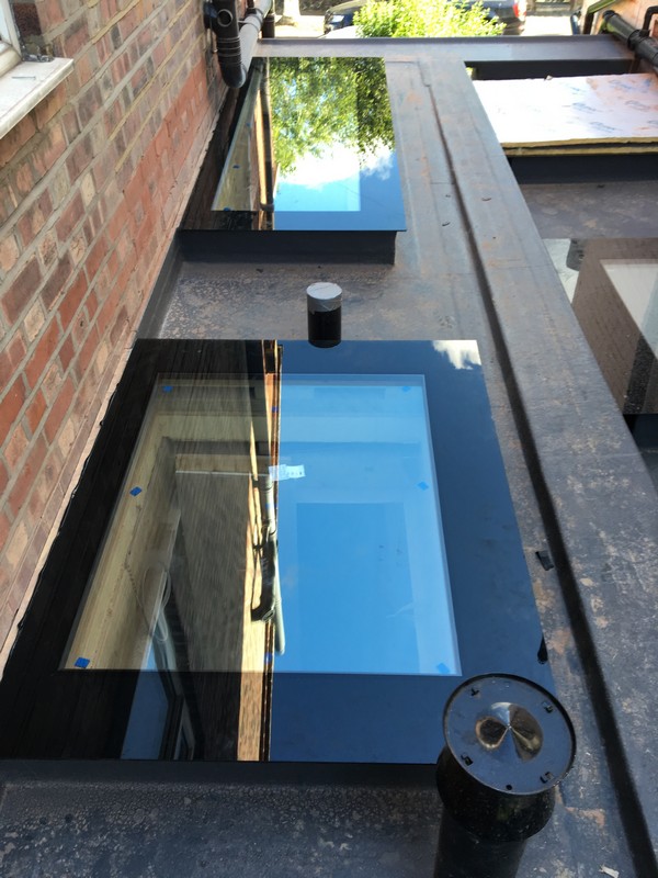Multiple flat roof skylights on extension in Winchmore Hill