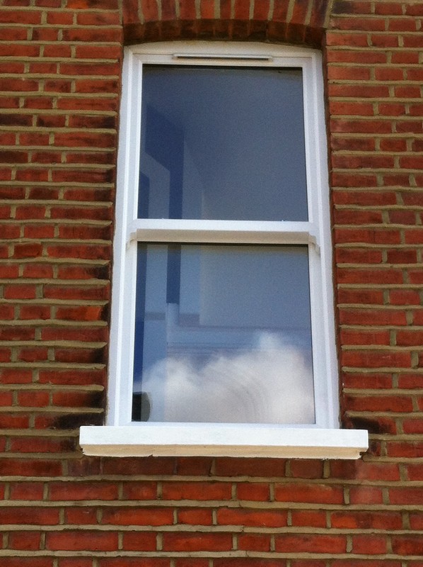 uPVC sash window on Victorian red brick house in Winchmore Hill